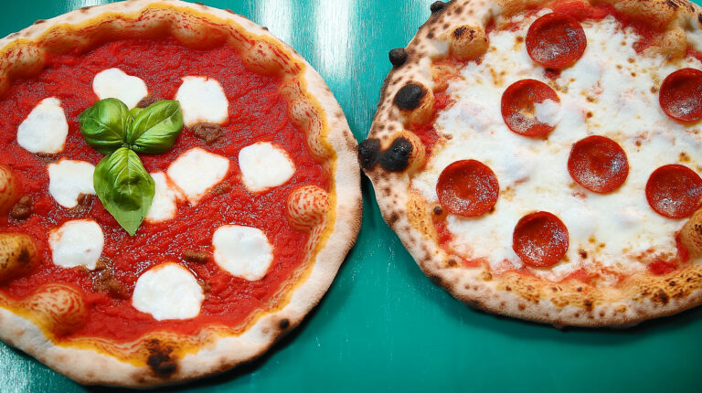 https://s.mj.run/oqlxBjW_l8w food photography of two delicious Italian pizzerias, one with tomato sauce and mozzarella on top in the style of, the other is covered in pepperoni meat and basil leaves in the style of, and another pizza has no baked cheese or pepperoncini, all on an electric blue background with natural light at a high resolution --chaos 90 --ar 16:9 --style raw --personalize m28mmtw --stylize 200 --weird 2400 --v 6.1 Job ID: ec1205cd-7393-4dc3-8735-32af9d20bb11